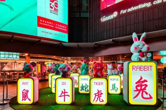 Colorful Chinese zodiac animal statues on illuminated blocks in a Singapore street display. Title: Chinese Zodiac Display Singapore